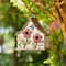Glitzhome® 10.5" White Distressed Wood Birdhouse with Flowers